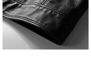Close-up of black PU leather jacket hem showing fine double stitching and pebble texture