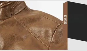 Detail shot of the shoulder stitching and lychee grain texture on a brown leather jacket