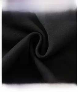 Close-up of black cotton blend knitted fabric showing fine texture and soft drape