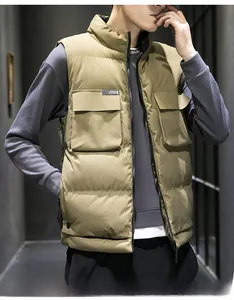 Detailed view of khaki utility vest with large flap pockets and a high stand collar
