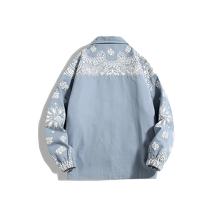 Back view of light blue colorblock jacket with white paisley patterns and drop shoulders