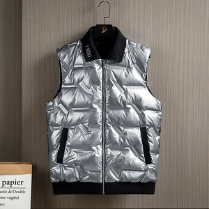 Mens glossy silver puffer vest with stand collar and textured COEXIST letter embossing