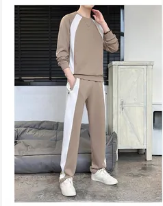 Detail of men's casual tracksuit featuring contrasting side stripes and drawstring waist
