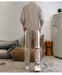 Rear view of men's khaki cotton sweatshirt and joggers set with white side stripes