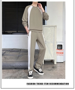 Detailed look at olive green tracksuit set with white side stripes and ribbed cuffs