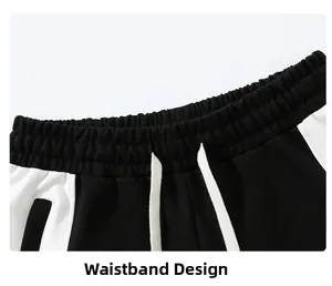 Detail view of elastic waistband with white drawstrings on casual cotton joggers