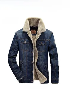 Detail of dark blue denim jacket with warm white fleece lining and metal buttons