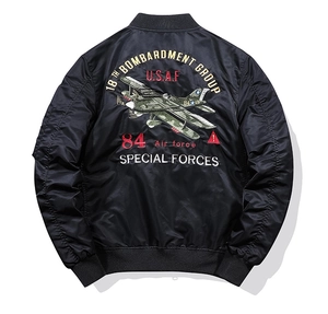 Detailed back view of black MA1 bomber jacket with military aircraft embroidery