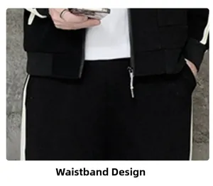 Detail of black sports jacket hem and tracksuit pants with white side stripes and waistband