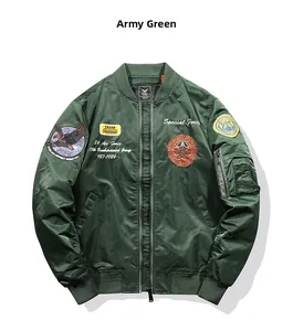 Detailed close-up of army green bomber jacket with military embroidery and sleeve pocket