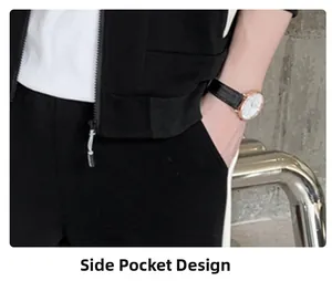 Detail view of the side pocket design on men's black athletic pants with white stripes