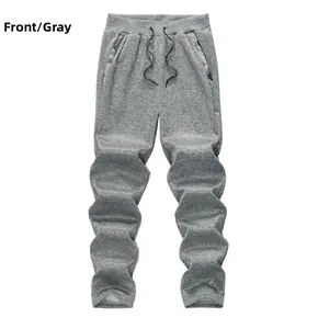 Détail du jogging en polaire gris pour homme avec cordon de serrage et poche à carreaux