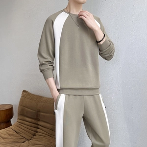 Men's olive green two-piece tracksuit with crewneck sweatshirt and jogger pants