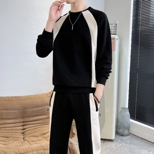 Men's casual black two-piece tracksuit with contrast cream stripes and raglan sleeves
