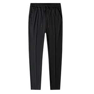 Men's lightweight stretch summer sports pants in black with drawstring and vertical pleats