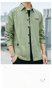 Detail of man's cargo shirt with large chest pocket and QINGLIAN patch embroidery