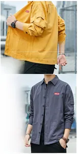 Detail view of cargo shirt multi-pocket design on yellow and dark grey fabric
