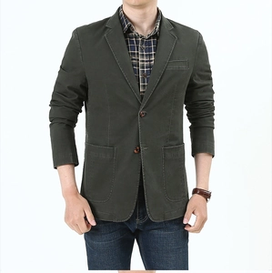 Detail view of men's dark green casual blazer featuring large pockets and cotton texture