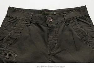 Detailed close-up of dark army green casual pants waist area with metal button and zipper