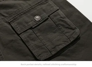 Close-up of cargo pants rear pocket with flap, metal button and double stitching