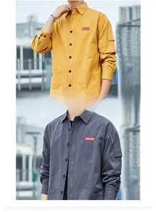 Detail of loose-fit men's shirts featuring chest embroidery and functional sleeve pocket