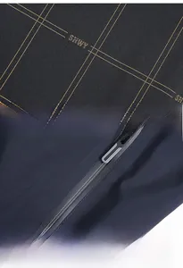 Detailed view of navy blue grid fabric and secure zipper pocket on casual jacket