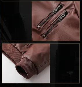 Détails d'une veste en cuir marron avec poches à double zip et poignets côtelés