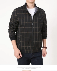 Close-up of men's casual jacket with brown plaid pattern, stand collar and ribbed cuffs