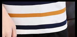 Detailed macro view of the knitted cotton fabric texture and striped pattern on the polo shirt