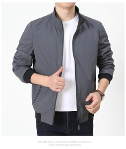 Detail of gray casual jacket with stand collar, ribbed cuffs and side zipper pockets
