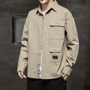 Men's khaki long sleeve utility shirt with flap pockets and industrial button-down collar
