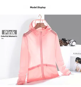 Detailed view of women's pink sun protection jacket with hood and zippered side pockets