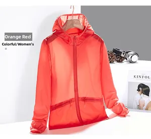 Detail of orange sun protection jacket featuring windproof zipper and elastic cuffs