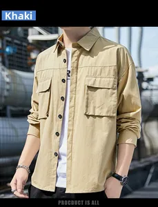 Detail of khaki men's long sleeve utility shirt with dual chest pockets and black buttons