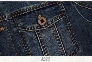 Detailed close-up of dark blue denim jacket pocket with embossed metal button