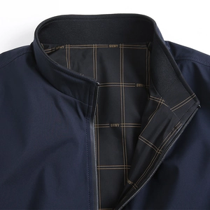 Men's navy reversible jacket with stand collar and detailed gold grid patterned lining