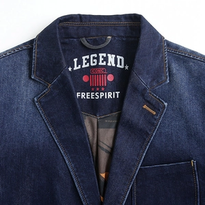 Classic deep blue denim blazer jacket with vintage label and notched lapel close-up