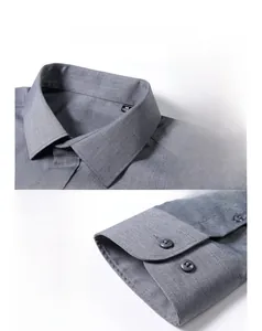 Detail of grey formal shirt showing square collar and textured fabric weave macro