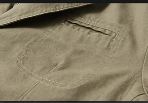 Detail of khaki twill jacket showing chest pocket and decorative double-stitching