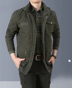 Detail view of army green military jacket with metal buttons and embroidered chest pocket