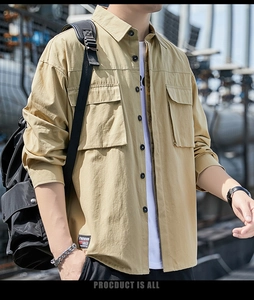 Detail of khaki men's casual shirt featuring front pockets and urban outdoor styling
