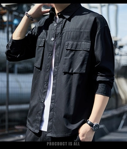 Detail of men's black utility shirt with double flap pockets and durable cotton fabric