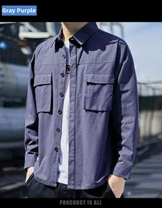 Detail of grey-purple men's long sleeve cargo shirt with dual chest pockets and buttons