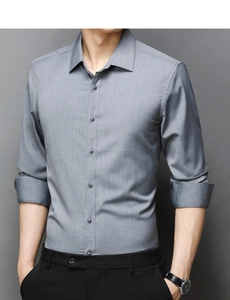 Detailed view of gray slim fit shirt with classic pointed collar and textured fabric