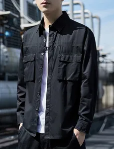 Close-up of black cargo long sleeve shirt showing chest pockets and durable fabric texture