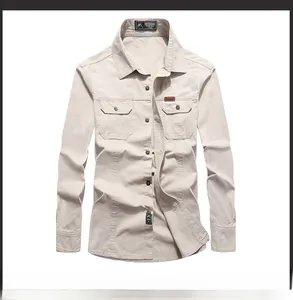 Detail view of cotton workwear shirt featuring dual flap pockets and a leather logo patch