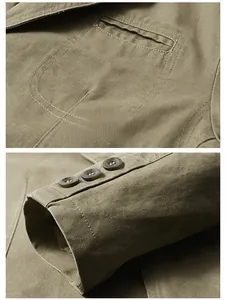 Detail of khaki jacket showing breast pocket and three-button windproof cuffs on heavy twill