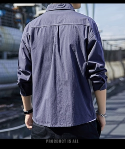 Detail of navy blue men's cotton shirt featuring back box pleat for comfortable casual fit