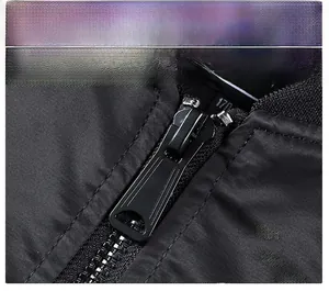Detail of high-density black metal zipper with smooth coating on pilot jacket
