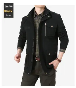 Detail of men's black utility jacket with functional flap pockets and embroidery